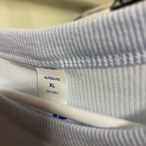 3 old navy crop tops. Baby blue,peach, and black